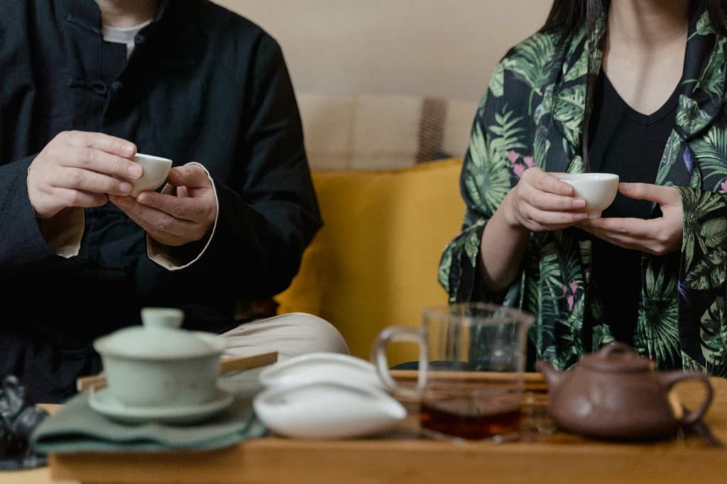 Two people enjoying tea during a tasting