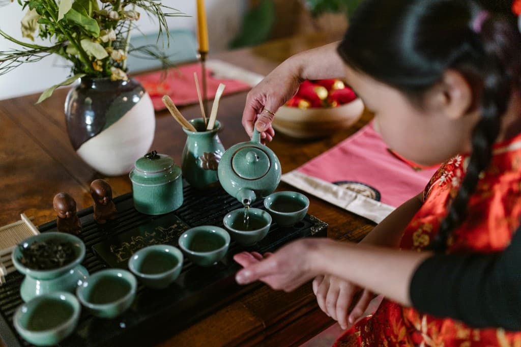 Tea set on a tray with pouring vessels